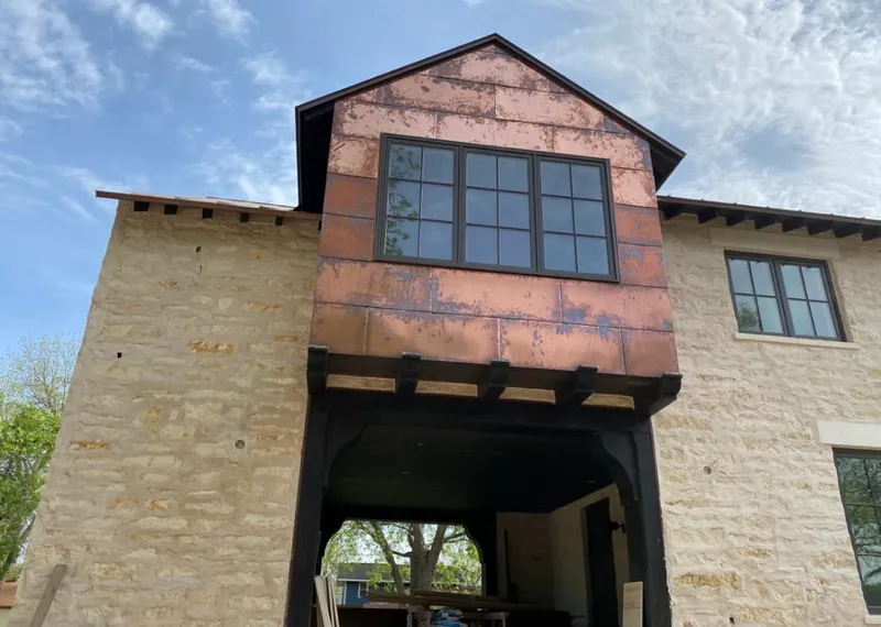Copper metal panel facade on a stone building for Metal Roof Coating in Litchfield